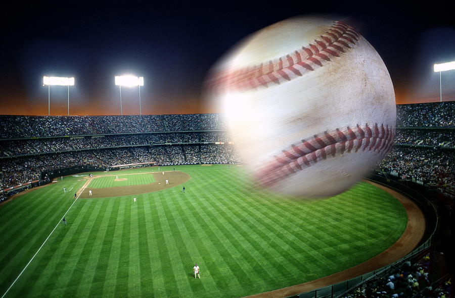 Baseball over stadium, blurred motion (Digital Composite) Photograph by David Madison