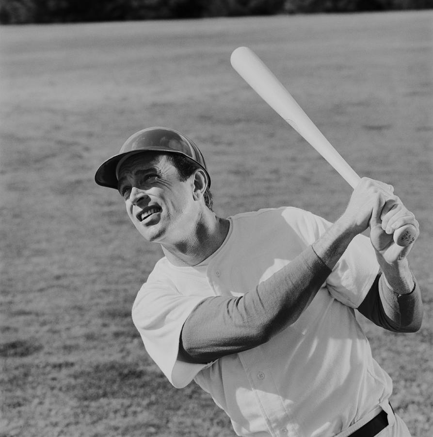 Baseball player swinging baseball bat Photograph by Tom Kelley Archive Baseball player swinging baseball bat Photograph by Tom Kelley Archive