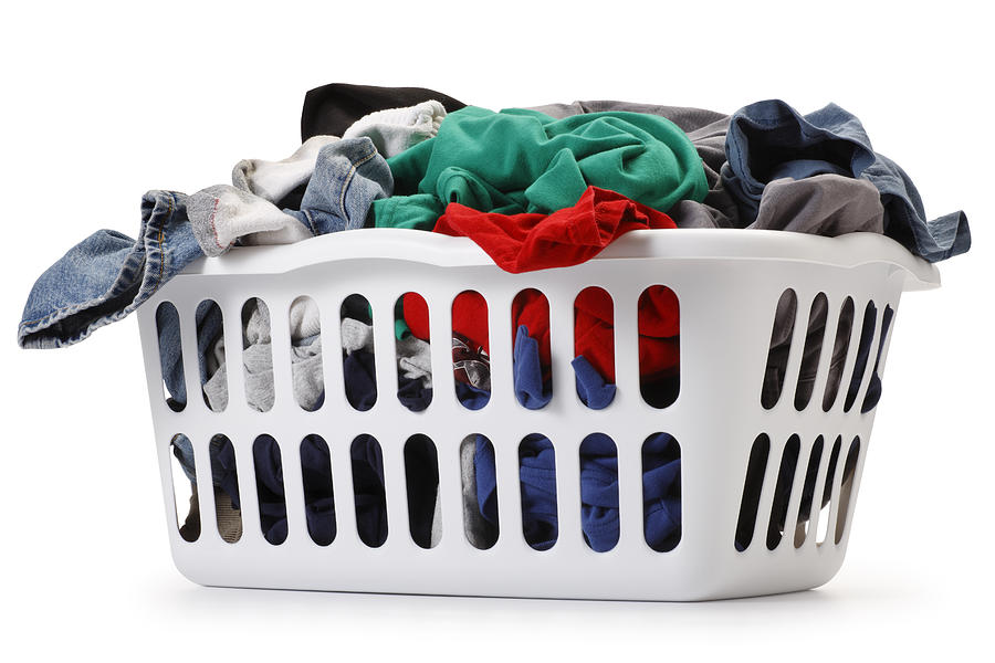 Basket of laundry on white background Photograph by Dny59