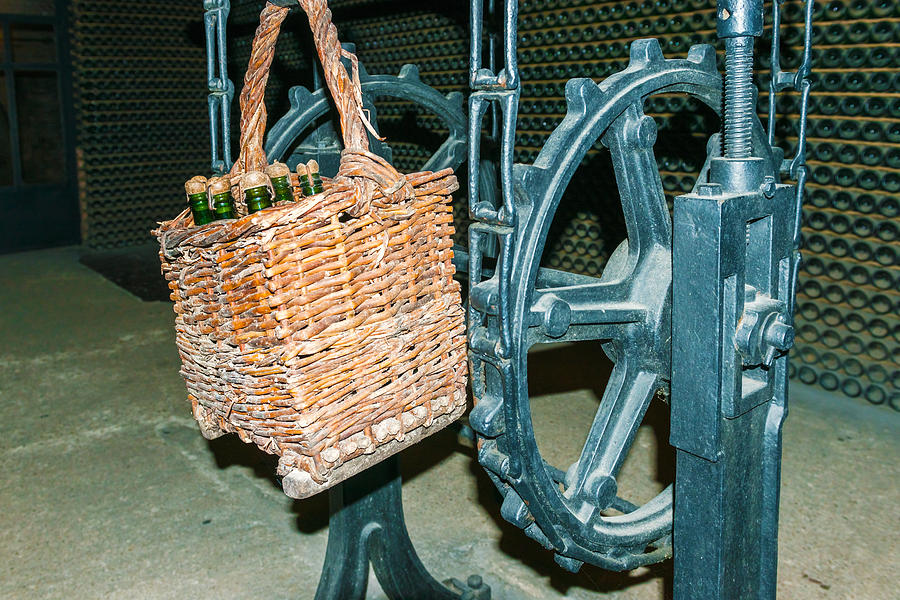 Basket with wine bottles in Codorniu winery Photograph by Marek Poplawski