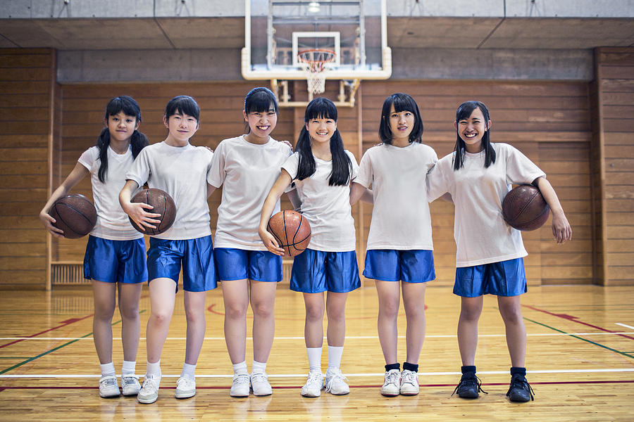 Basketball girls team in the school gymnasium Photograph by Xavierarnau