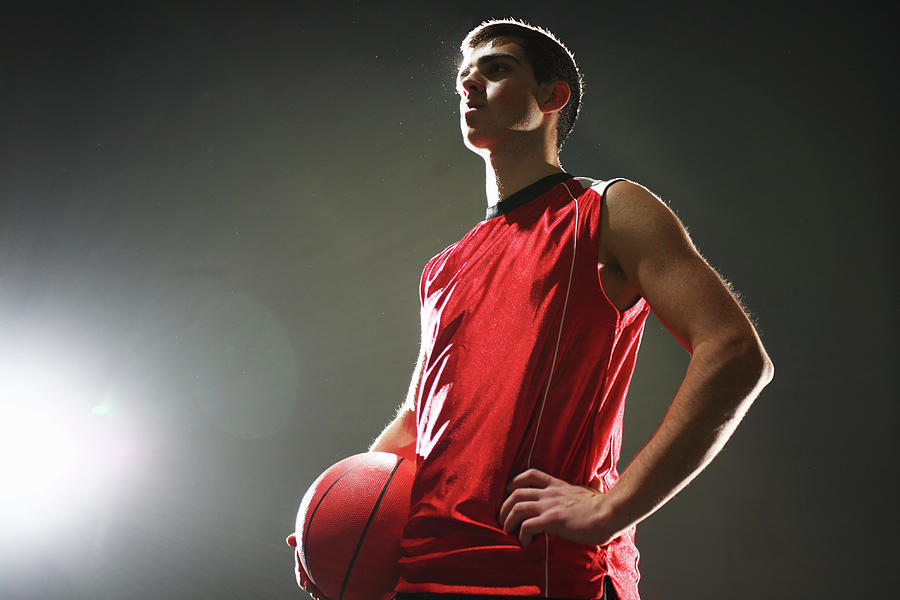 Basketball Player Standing With Ball Photograph by Stanislaw Pytel