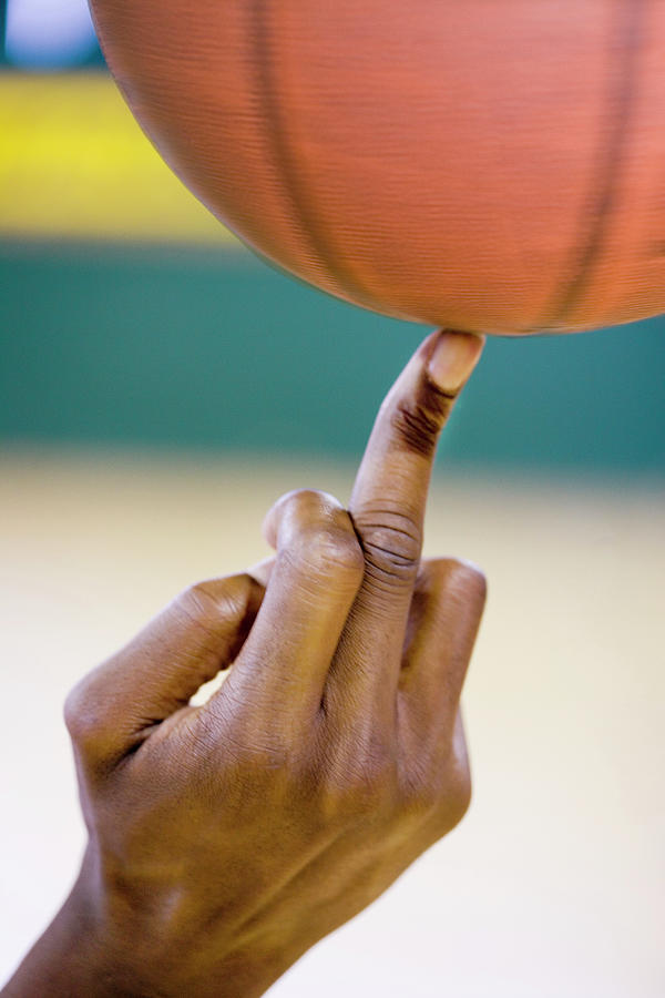 Basketball Spinning On A Finger by Gustoimages/science Photo Library