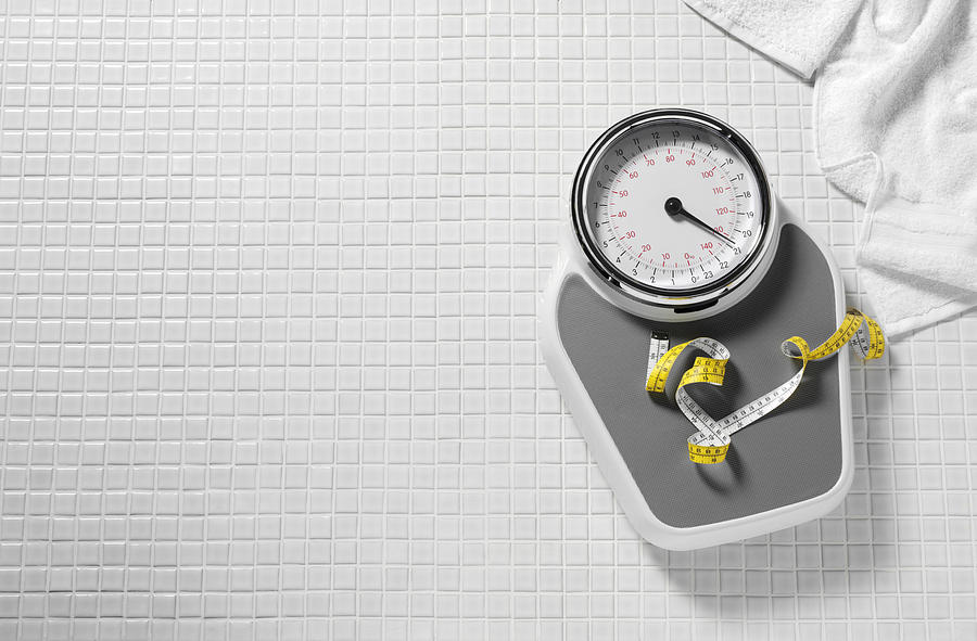 Bathroom Scales and Tape Measure Photograph by Wragg