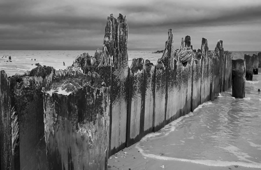 Battered Pier on the Beach Photograph by Jennifer Lycke