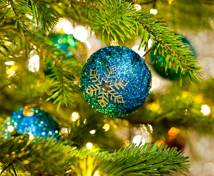 Holiday Photograph - Bauble in a Christmas tree  by U Schade
