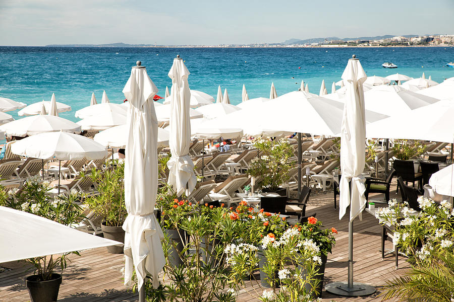 Beach bar with a Flowered terrace. in french riviera Photograph by Jean-Marc PAYET