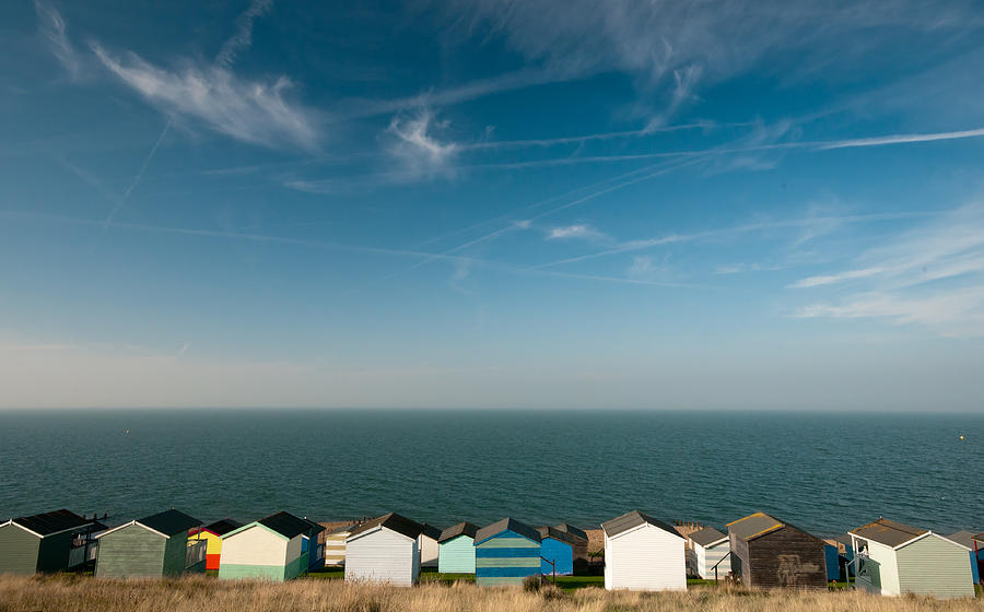 Blue sky ocean and Beach huts Whitstable Photograph by Michalakis Ppalis