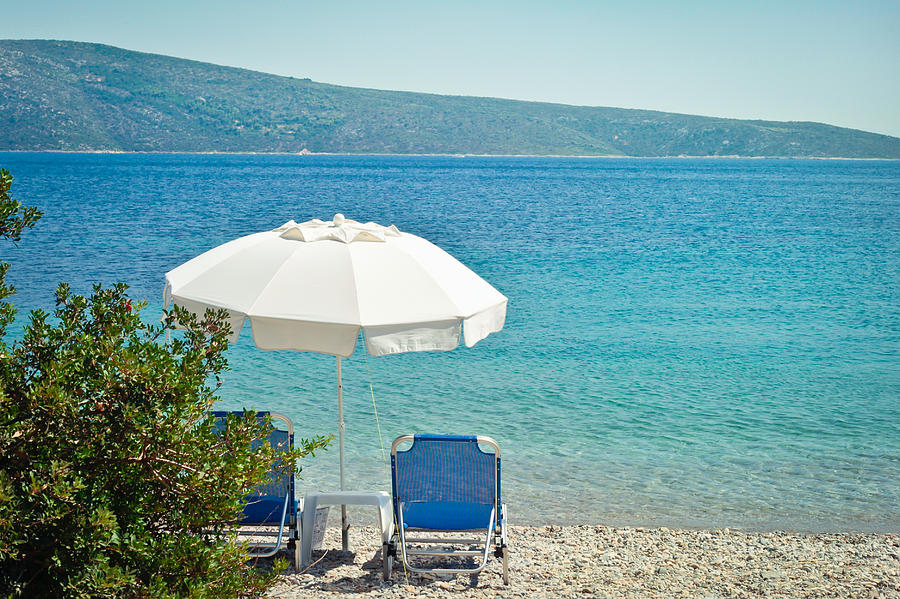 Greek Photograph - Beach parasol by Tom Gowanlock