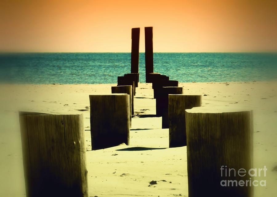 Beach Pylons Photograph by Sharon Woerner