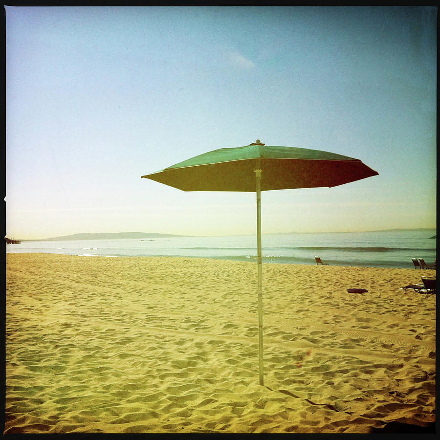 Beach Umbrella On Sand Photograph by Denise Taylor
