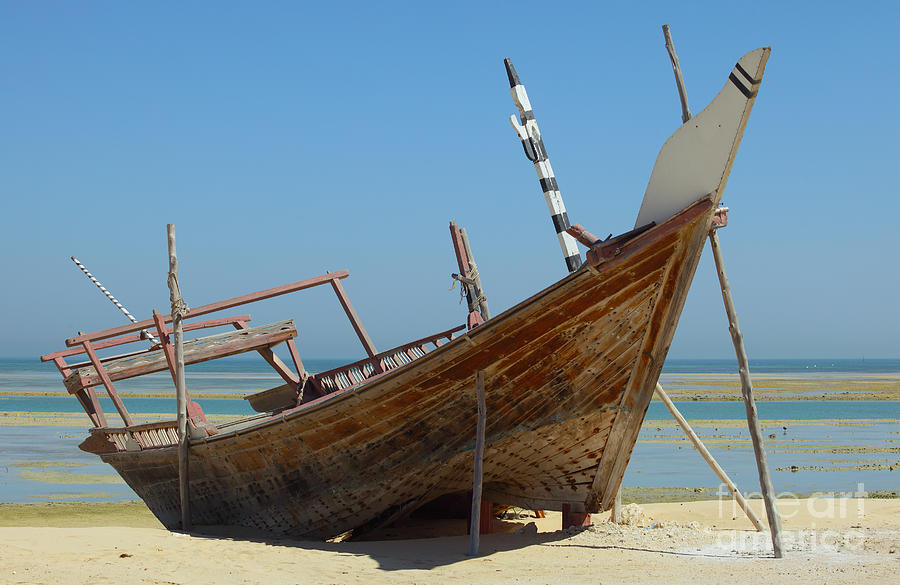 Beached dhow at Wakrah Photograph by Paul Cowan