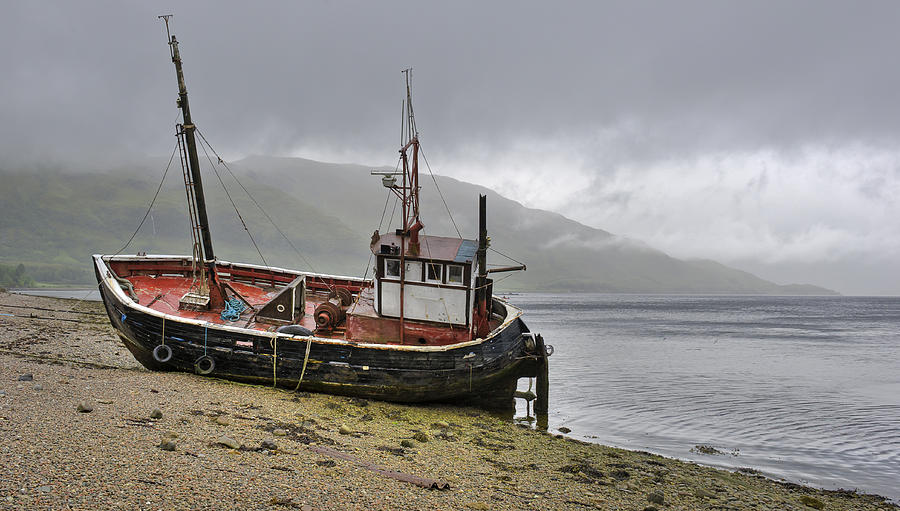 Beached fishing boat Photograph by Gary Eason