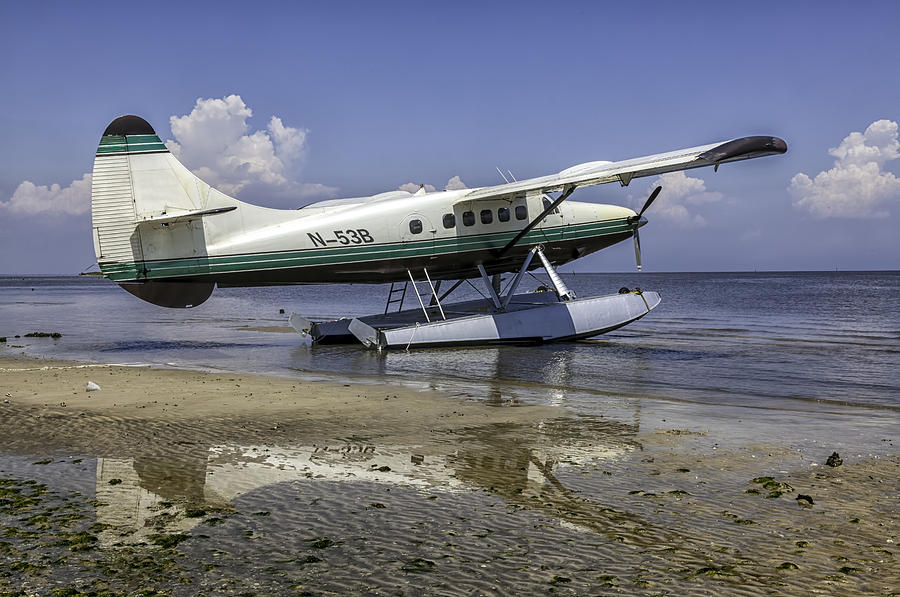 beached pontoon sea plane photograph by lynn palmer