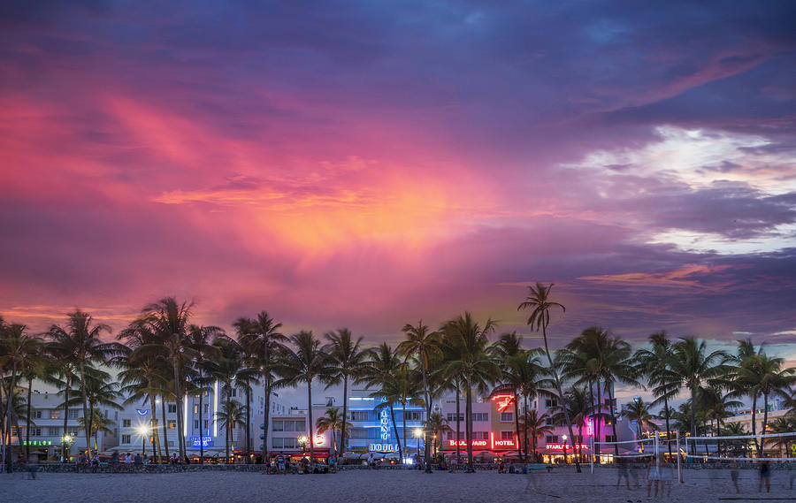 Beachfront buildings under sunset sky Photograph by Ac Productions