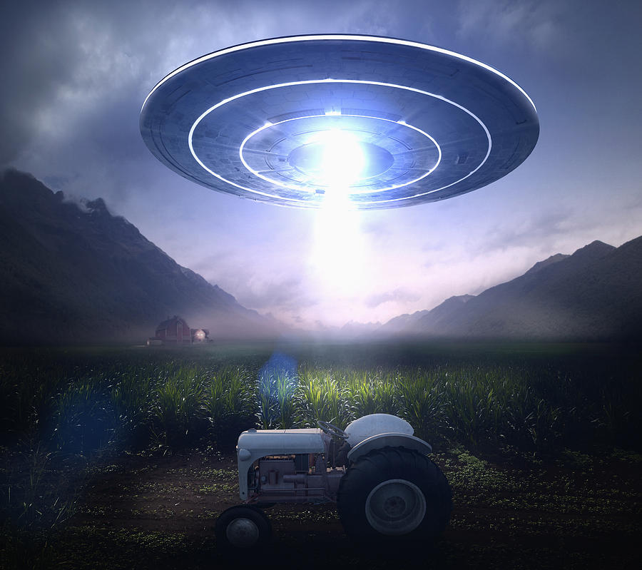 Beam from UFO over tractor at farm Photograph by Colin Anderson Productions pty ltd