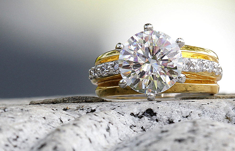 Beatiful Diamond Ring Sitting On Granite Stone Photograph by Fruit_Cocktail