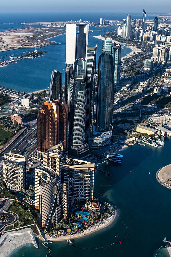 Beautiful aerial view of the famous Abu Dhabi high-rise buildings, taken from a helicopter, United Arab Emirates Photograph by Extreme-photographer