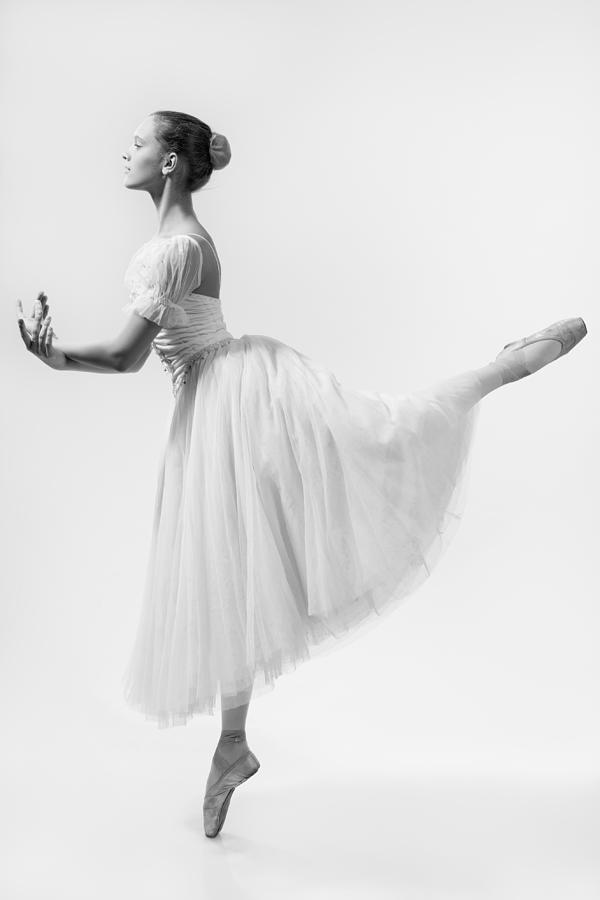 Actor Photograph - Beautiful ballerina dances in a white dress by Ilya Lokalin