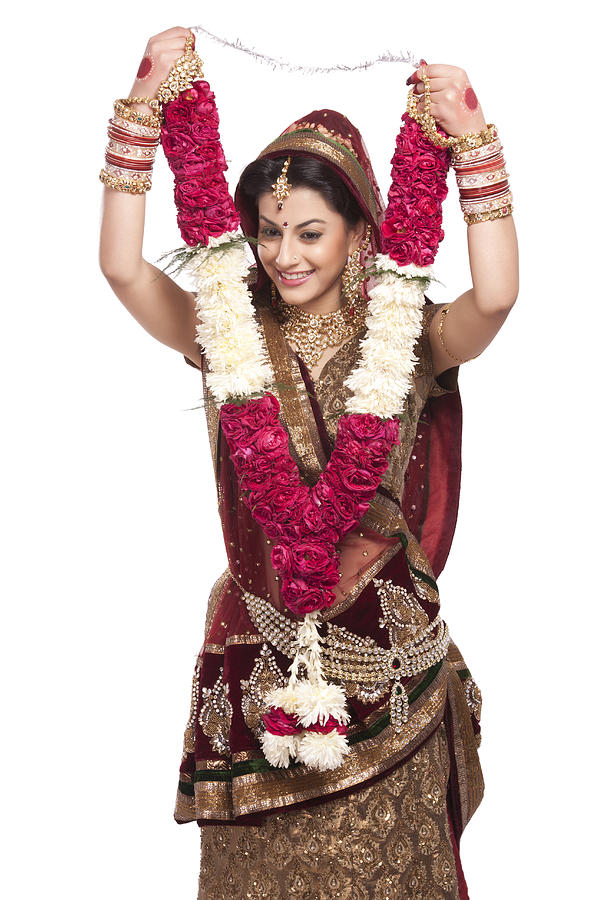 Beautiful bride holding a garland Photograph by Sudipta Halder