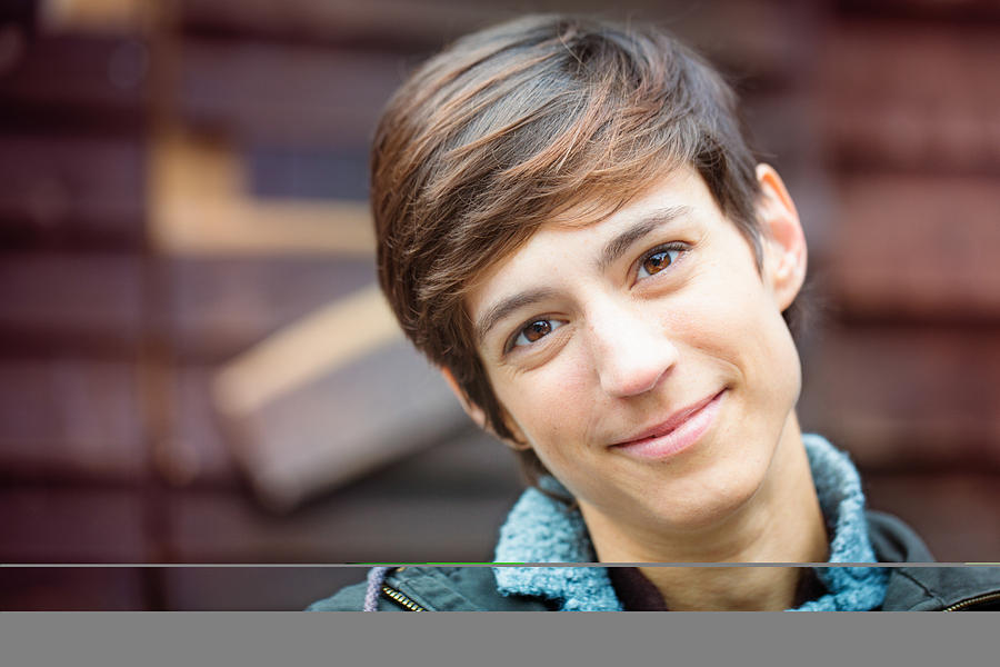 Beautiful cheerful young androgynous British woman kind smile Photograph by NicolasMcComber