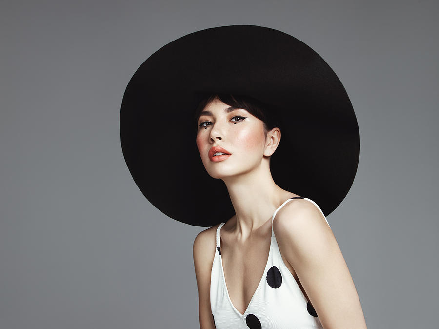 Beautiful elegant woman with oversized hat Photograph by Lambada