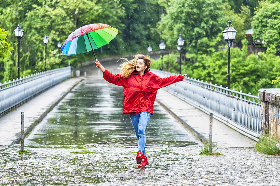 Beautiful girl with umbrella dancing in the rain Photograph by Vladimir Vladimirov