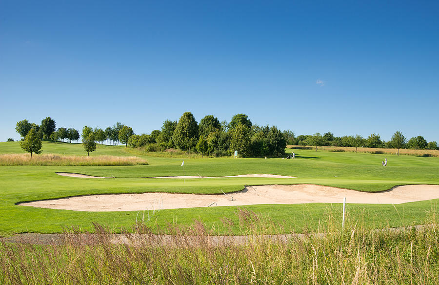 Beautiful green golf course and blue sky Photograph by Matthias Hauser