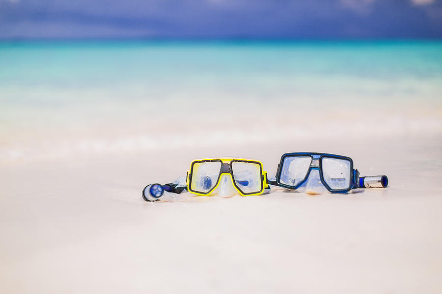 Beautiful Maldives beach with two snorkel mask. Romantic beach background. Photograph by Levente Bodo