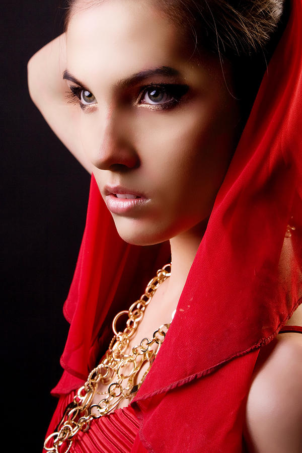 Beautiful Model In Red Dress Posing In Studio by Daniel Barbalata