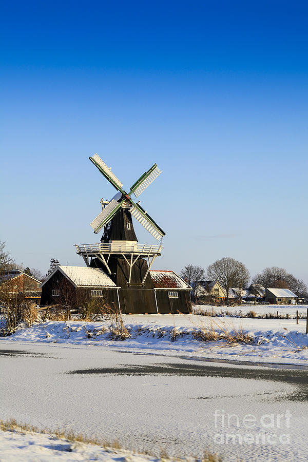 Beautiful old Dutch woodmill of 1903 in winter Photograph by Patricia Hofmeester