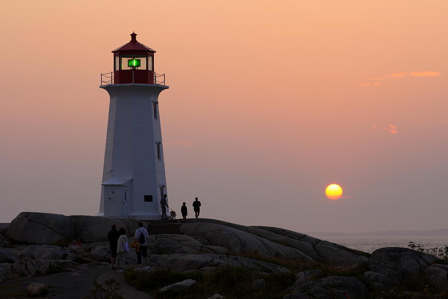Beautiful Peggys Cove Lighthouse sunset Photograph by Gary Corbett