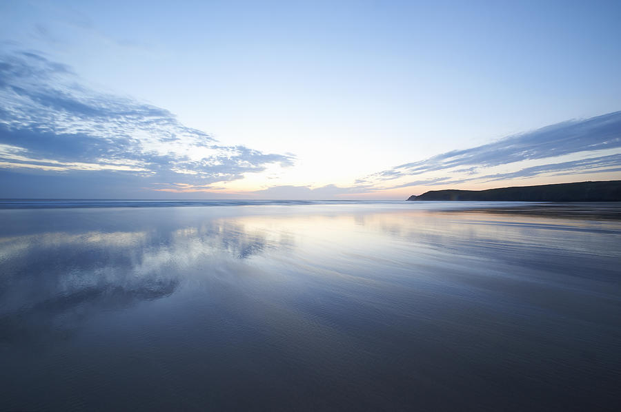Beautiful seascape reflections at dusk. Photograph by Dougal Waters