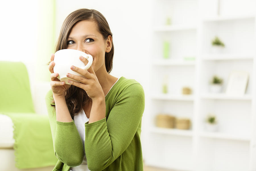 Beautiful woman enjoying a cup of coffee at home Photograph by Eva-Katalin