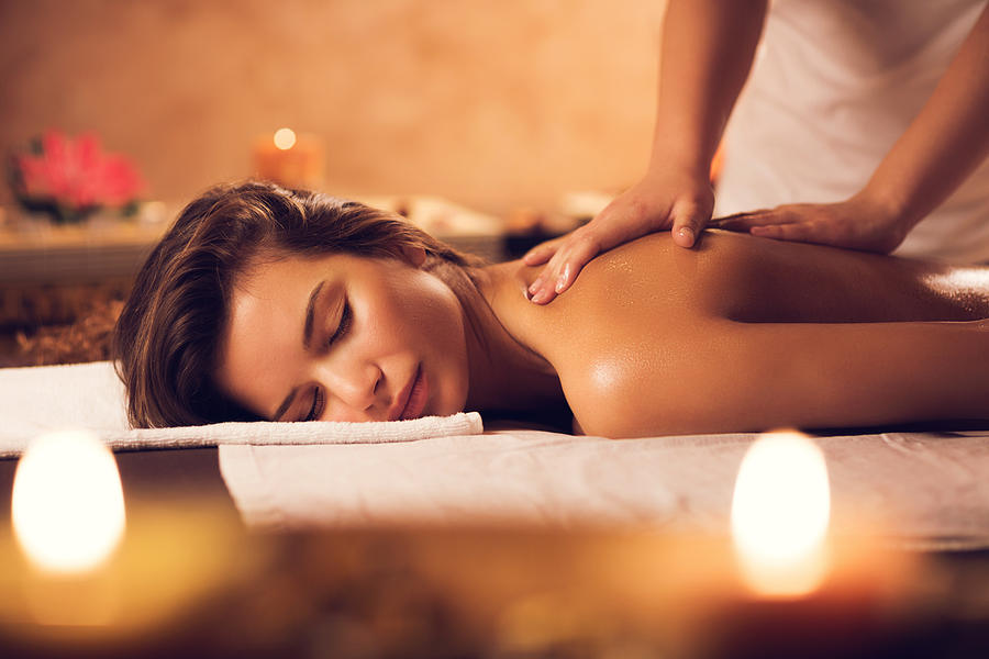 Beautiful woman having a massage at the spa. Photograph by BraunS