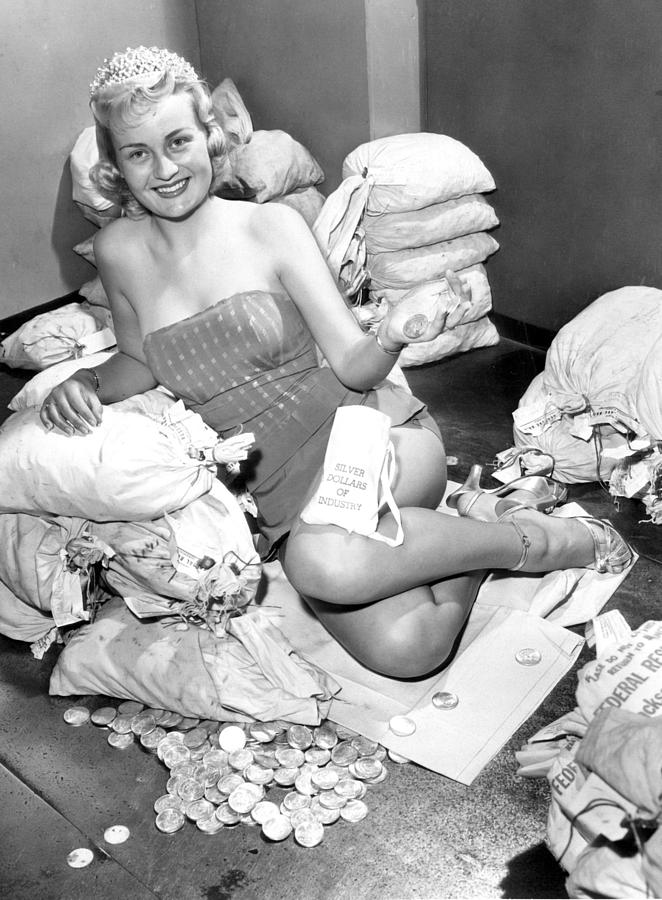 Vintage Photograph - Beauty surrounded by money by Retro Images Archive