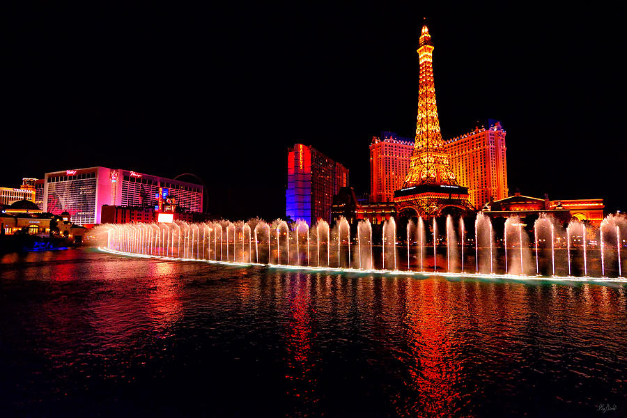 Bellagio Fountain Show at Night Photograph by Greg Norrell