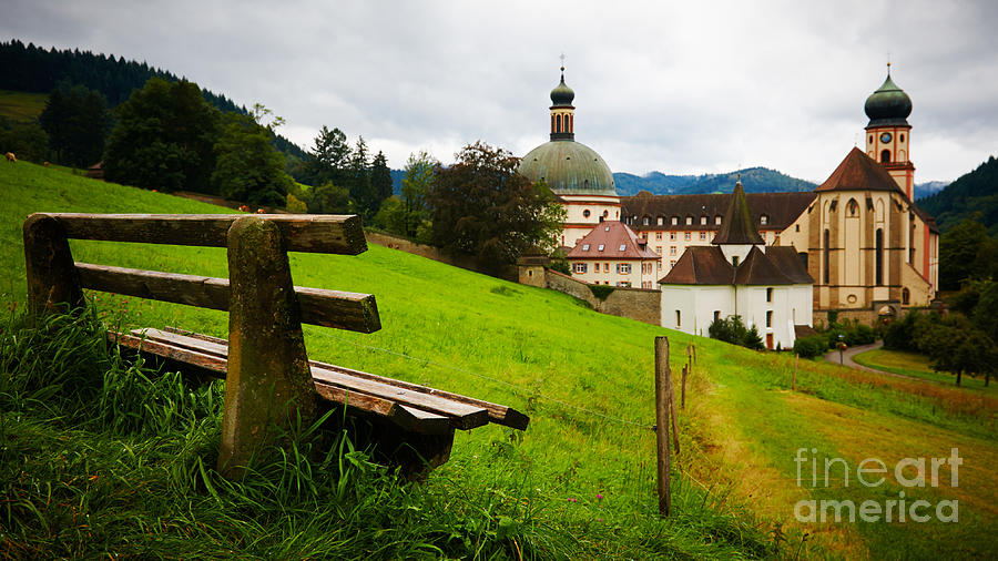 Bench Overlooking A Historic Monastery Photograph
