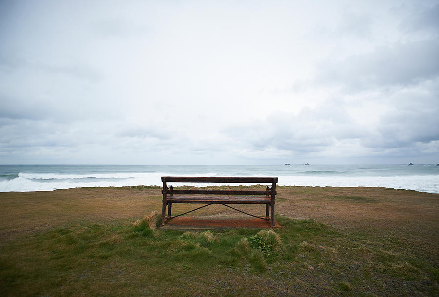 Bench Overlooking Uk Coastline Photograph by Dougal Waters
