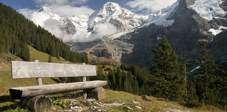 Color Image Photograph - Bench With Mt Eiger And Mt Monch by Panoramic Images Color Image Photograph - Bench With Mt Eiger And Mt Monch by Panoramic Images