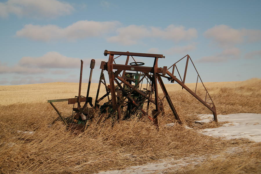 Bereft farm equipment Photograph by Jeff Swan