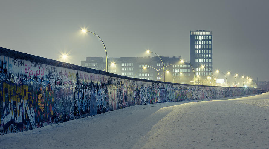 Berlin wall at winter with mist an nightlights Photograph by Spreephoto.de