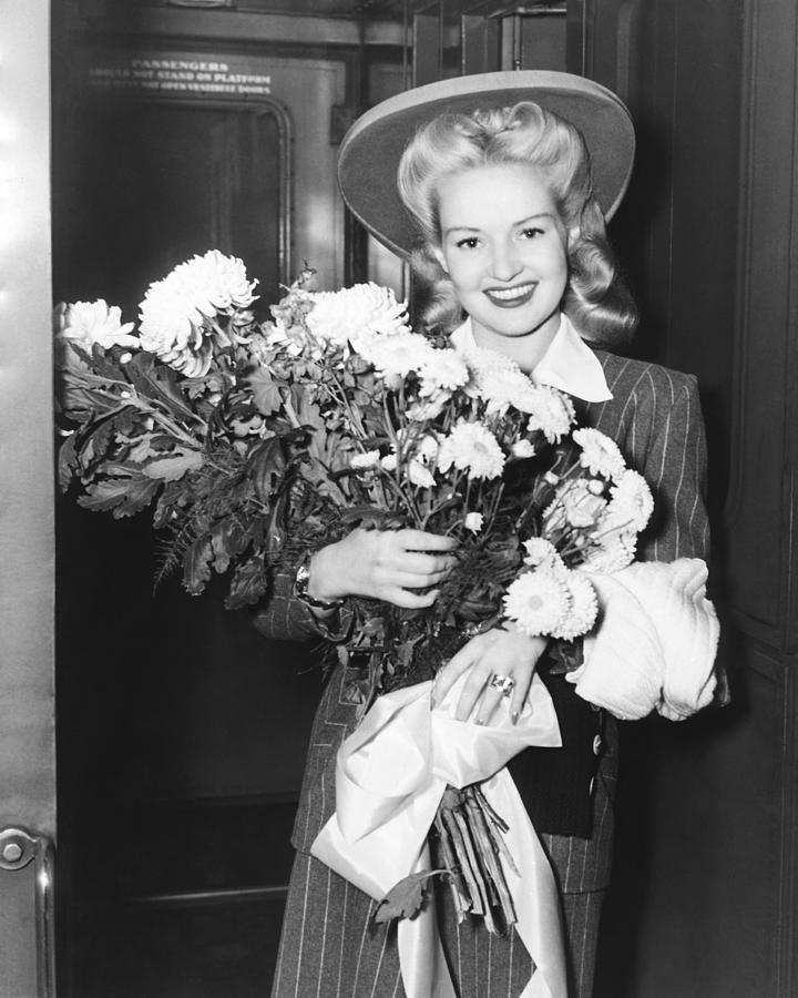 Betty Grable With Flowers Photograph by Underwood Archives