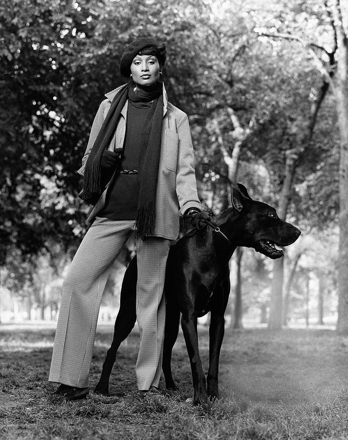 Beverly Johnson With A Dog Photograph by Francesco Scavullo