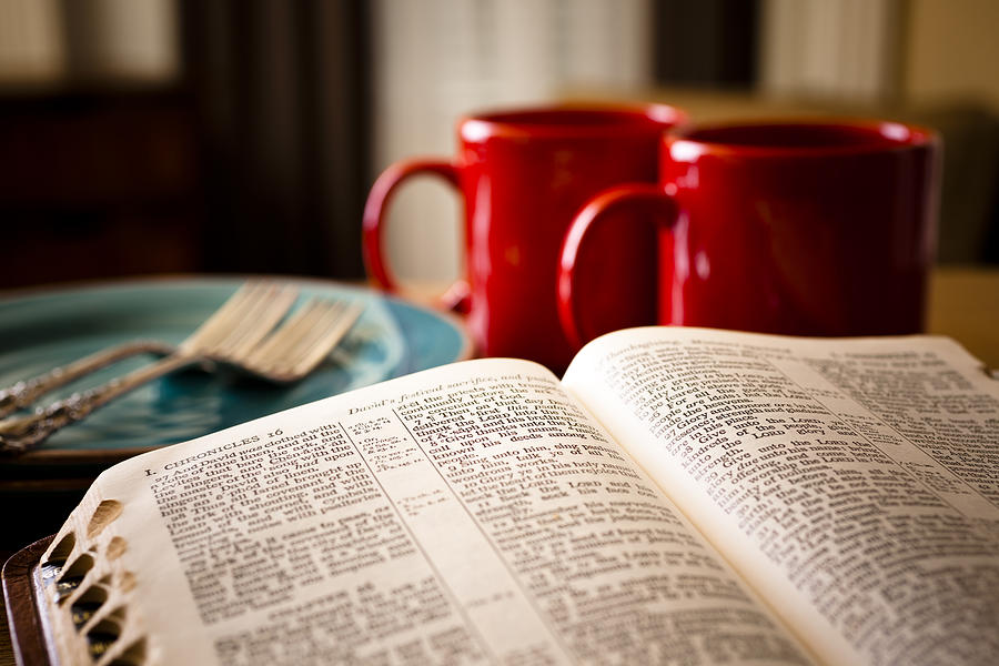 Bible and coffee set for two with red mugs plates Photograph by Fstop123