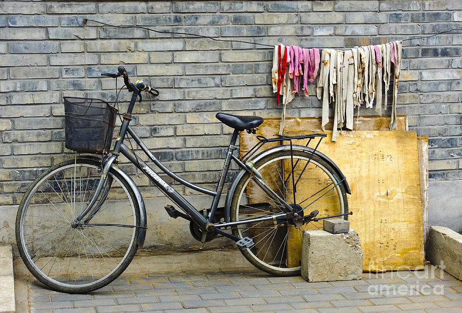 Bicycle Photograph - Bicycle In An Alleyway by John Shaw