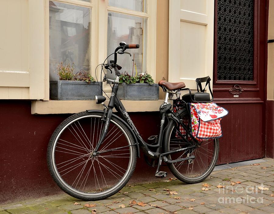 Bicycle with baby seat at doorway Bruges Belgium Photograph by Imran Ahmed