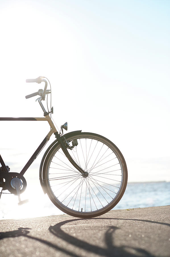 Bicycle With Sea In Background Photograph by Johner Images