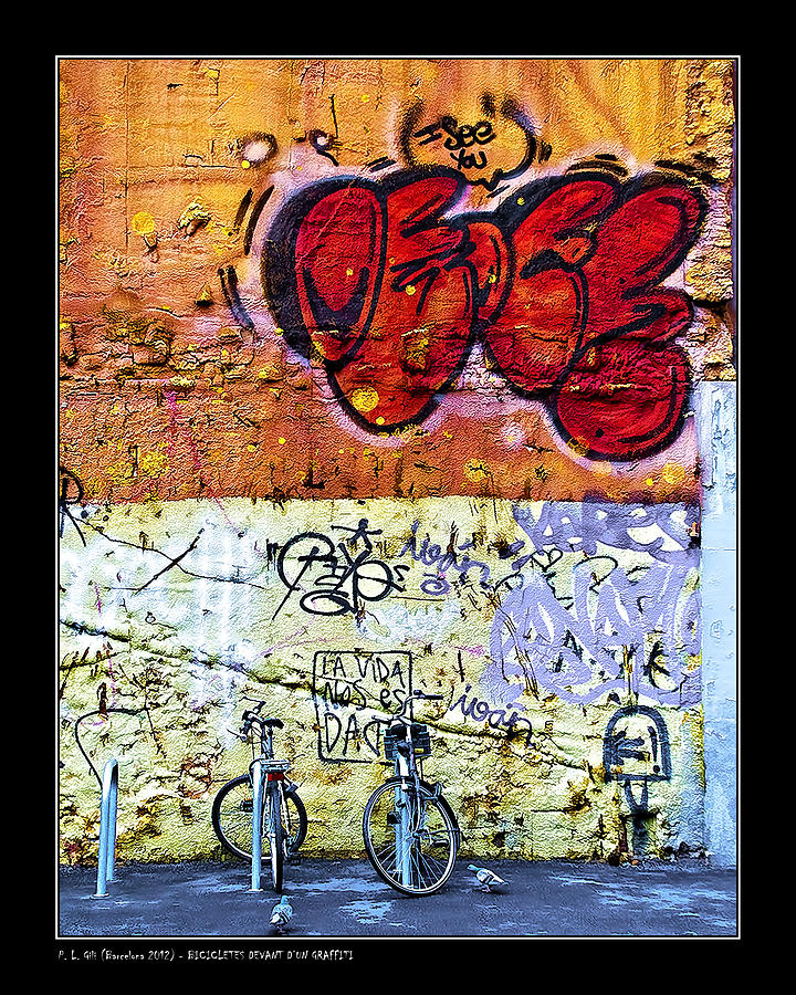 Bicycles in front of a graffiti Photograph by Pedro L Gili
