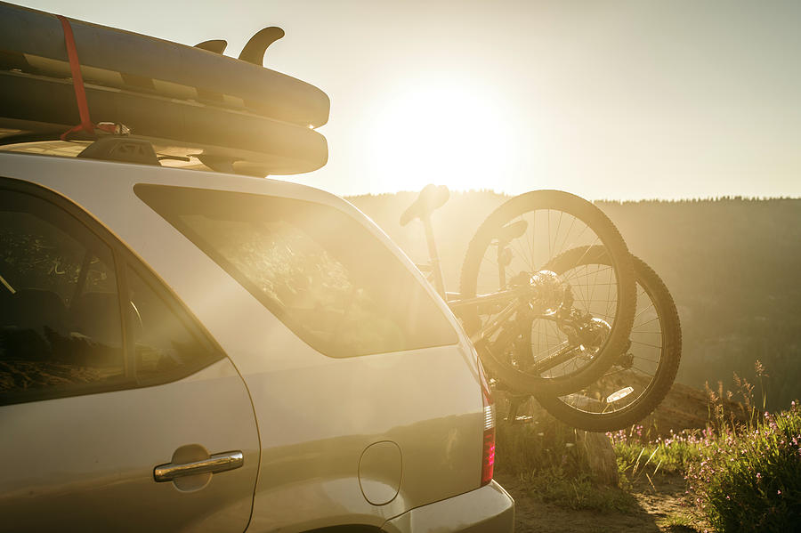 Sunset Photograph - Bicycles On Rack On Back Of Car by Melissa Shelby